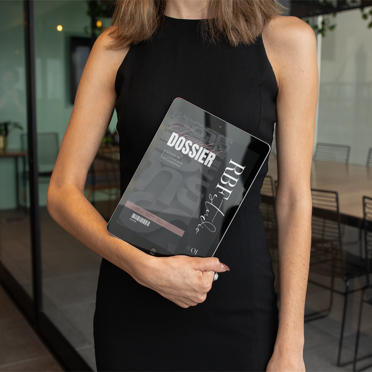 Person holding a tablet with RBF Studio's The Founder's Dossier pulled up on it.