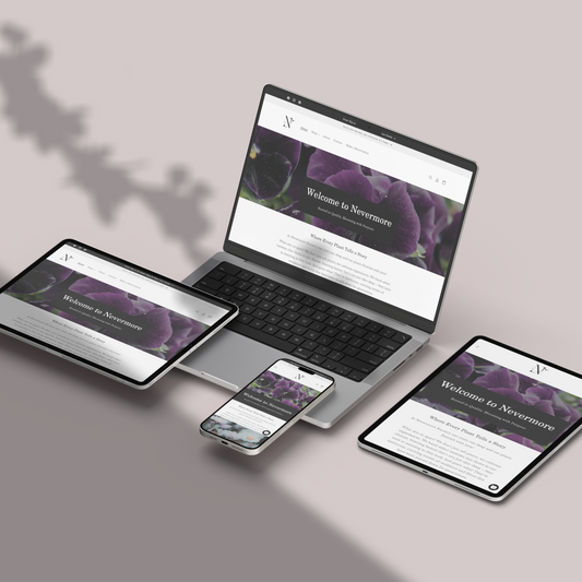 Laptop, tablet, and smartphone displaying a website on a gray background
